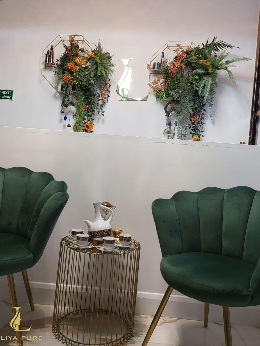 Green velvet seating in the salon