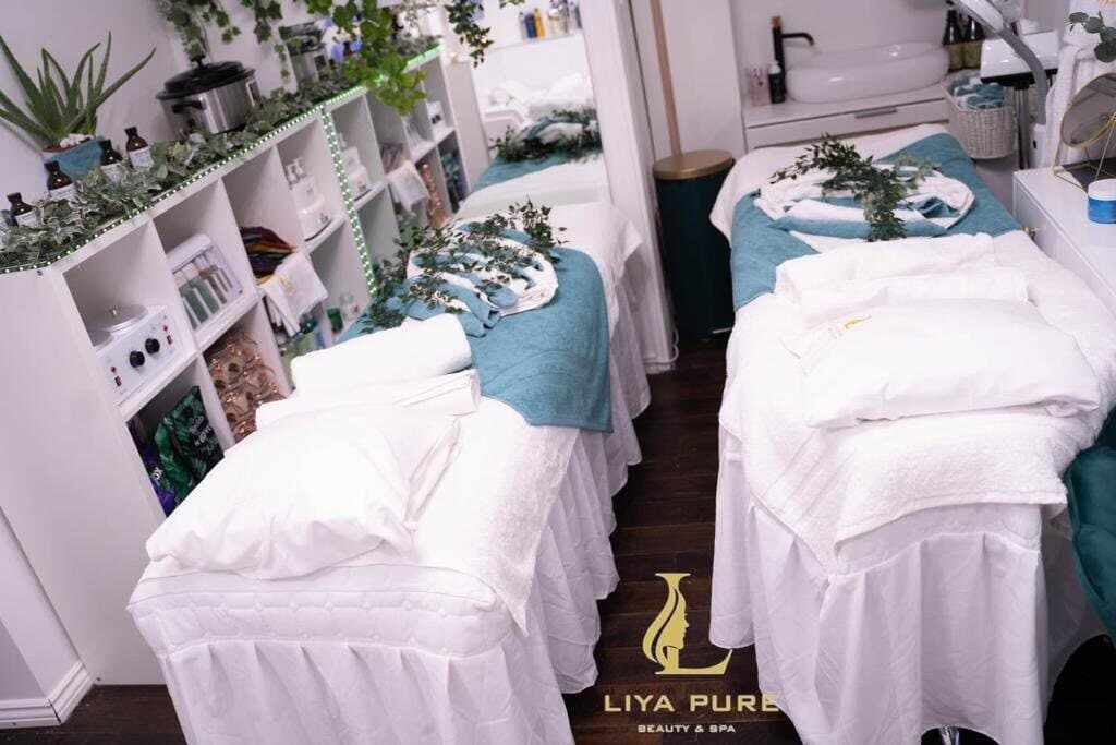 Treatment room with beds and soft lighting